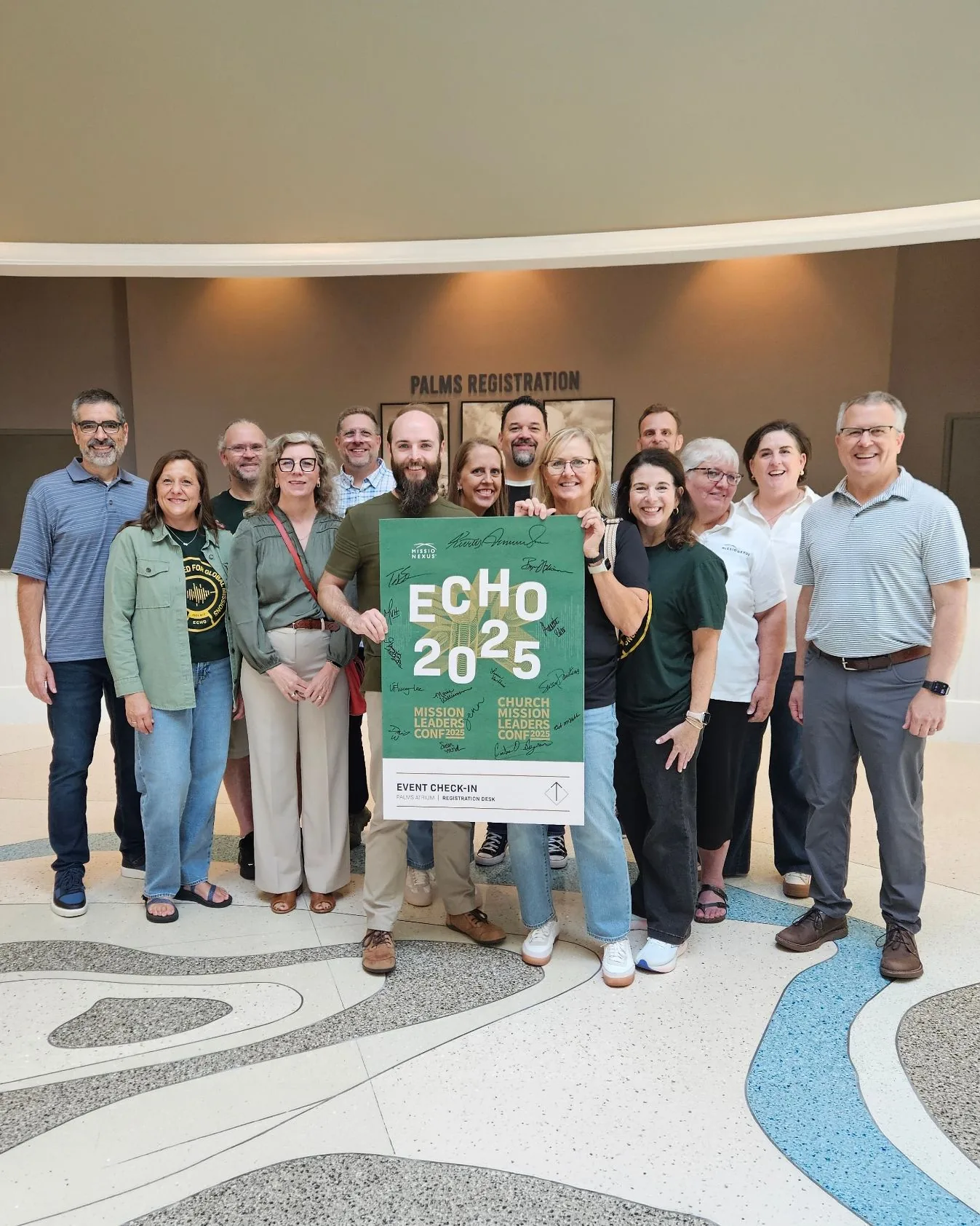 The Missio Nexus team with the signed ECHO 2025 conference poster