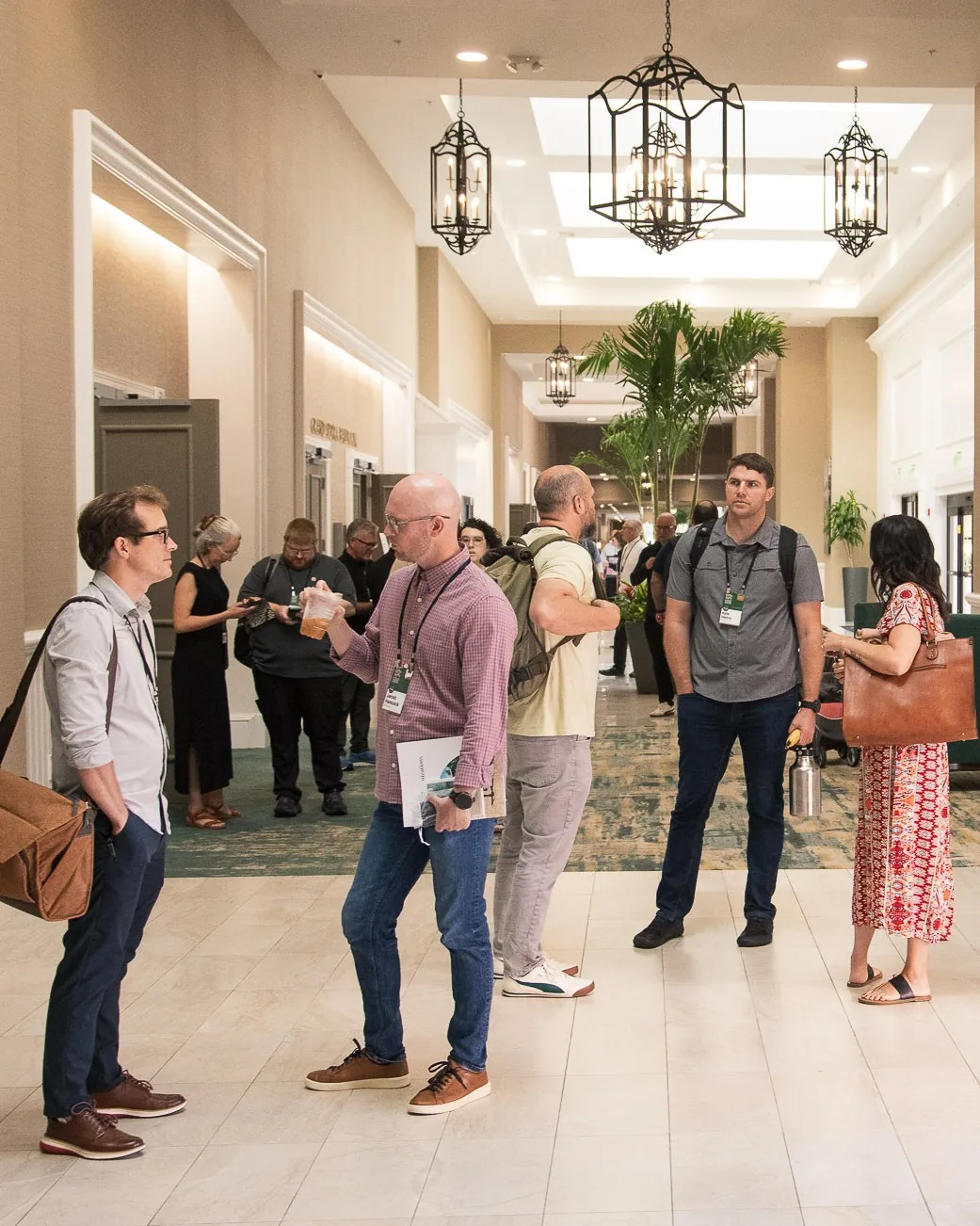 Attendees talking in the lobby between sessions