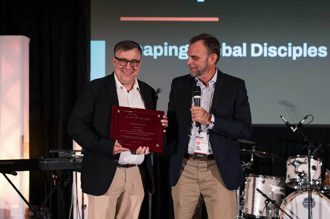 An award plaque presented on stage at MLC 2026