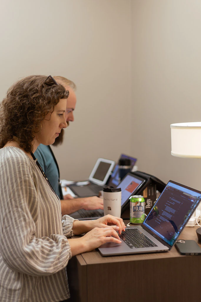 A leader working quietly at a laptop