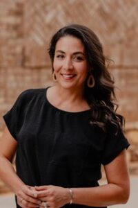 Woman teaching young people about discipleship and mission in a church setting.