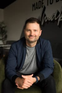 Portrait of a smiling man in a casual setting at Missio Nexus.