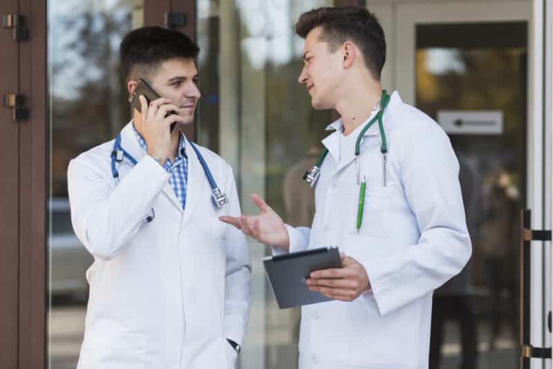 young-medics-talking-door